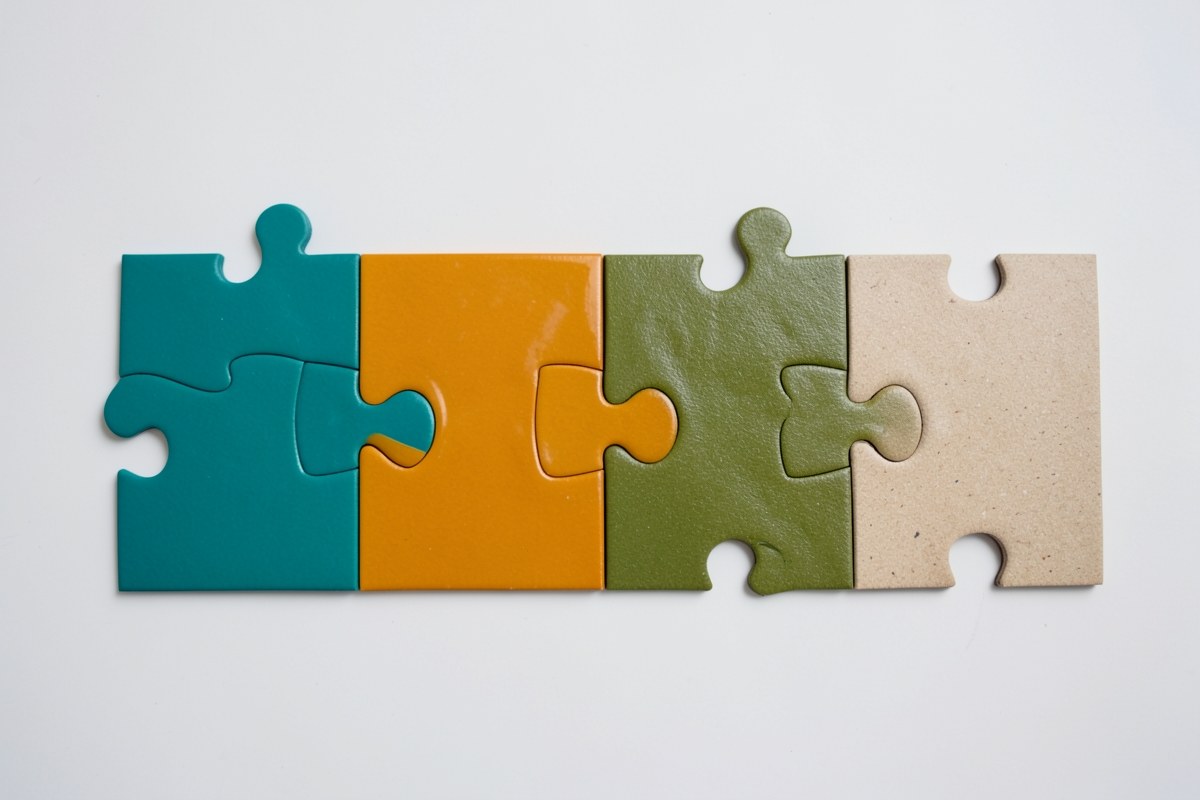A row of different colored puzzle pieces